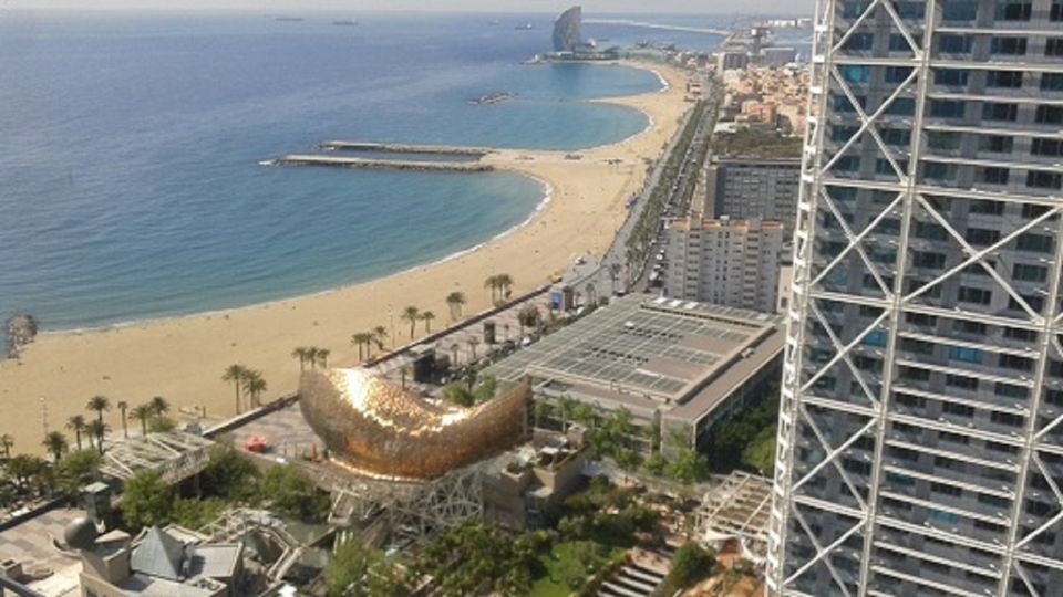 Barcelona: Faces of the City Bike Tour - Riding Along the Beach