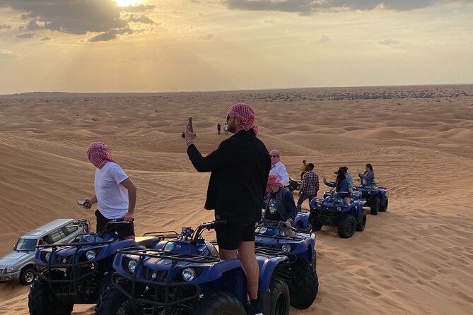 Dubai Red Dunes Quad Bike Tour,Sandboard, Camel Ride & BBQ Dinner - Henna Tattoo Painting