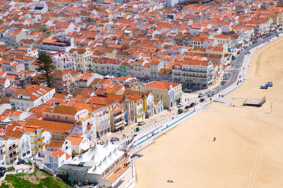 From Lisbon: Private Transfer to Porto, With Stop at Nazaré - Traditional Fishing Boats