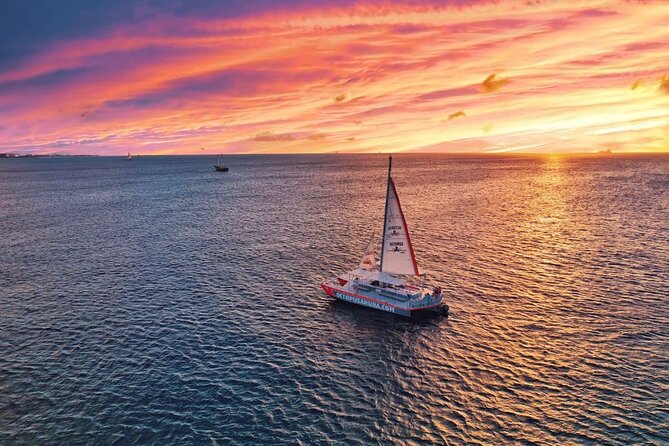 Aruba Happy Hour Sunset Sail With Savory Bites and Cocktails - Boarding and Check-in Details