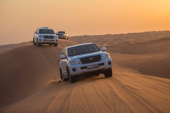 Desert Safari With Quad Bike Sand Boarding and a Camel Ride - International Buffet Dinner