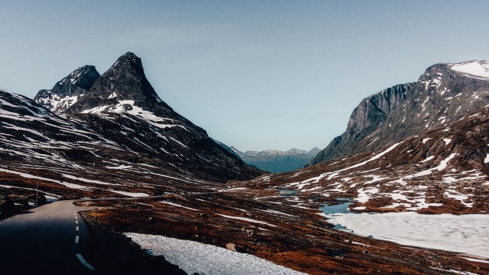 From Ålesund: Trollstigen Sightseeing Village & Fjord Tour - Trollvegen Rock Face