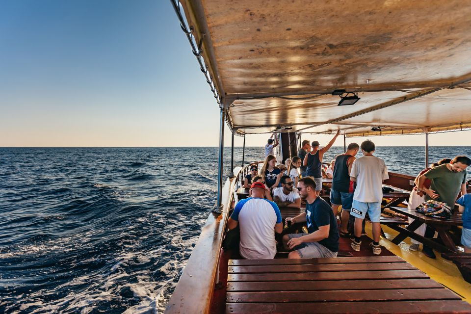 Kamenjak/Medulin: Sunset Dolphin Boat Tour With Dinner - Accessibility and Languages