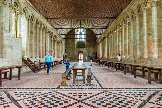 Mont Saint Michel Day Trip From Paris With English Speaking Guide - Exploring the Monastery