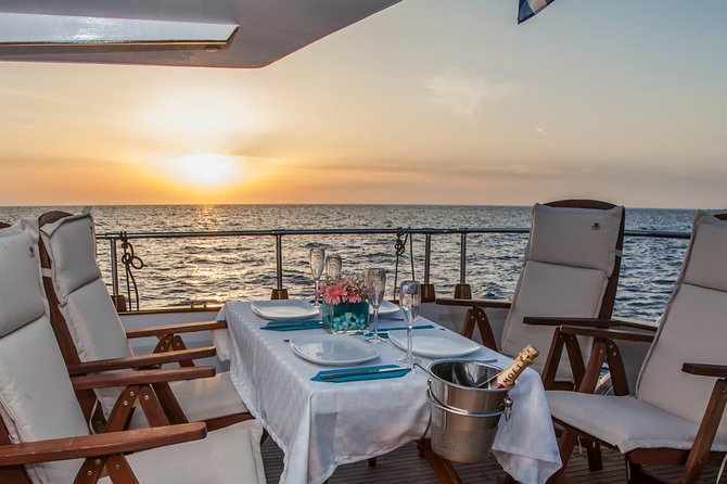 Santorini: Motor Yacht Sunset Cruise With 5-Course Dinner - Seasonal Sunset Adjustments