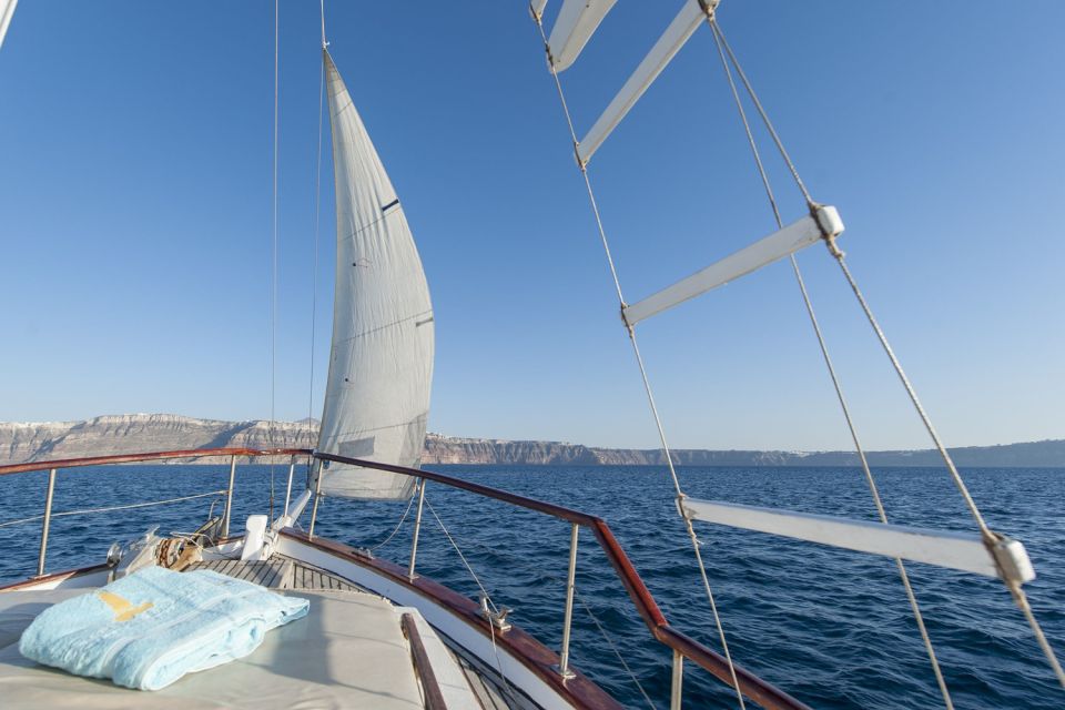 Santorini: Traditional Wooden Boat Tour With Meal and Wine - Included Activities and Experiences