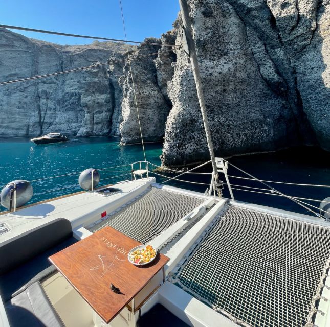 Santorini Catamaran Cruise With Swimming, Meal and Open Bar - Booking and Cancellation Policy