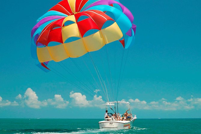 Parasailing With Catamaran Booze Cruise and Snorkeling - Key Points