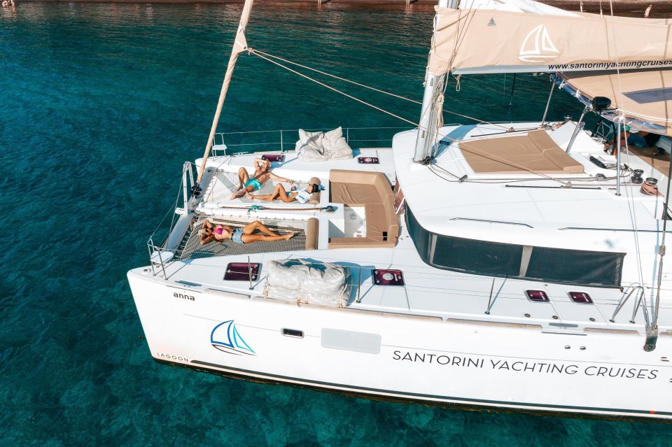 Santorini Catamaran Day Cruise: Lunch, Drinks and Transfers - Key Points