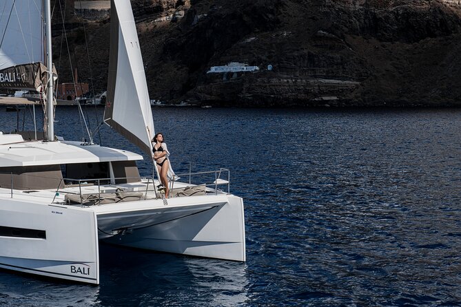 Shared Catamaran Half Day Cruise in Santorini - Confirmation and Accessibility