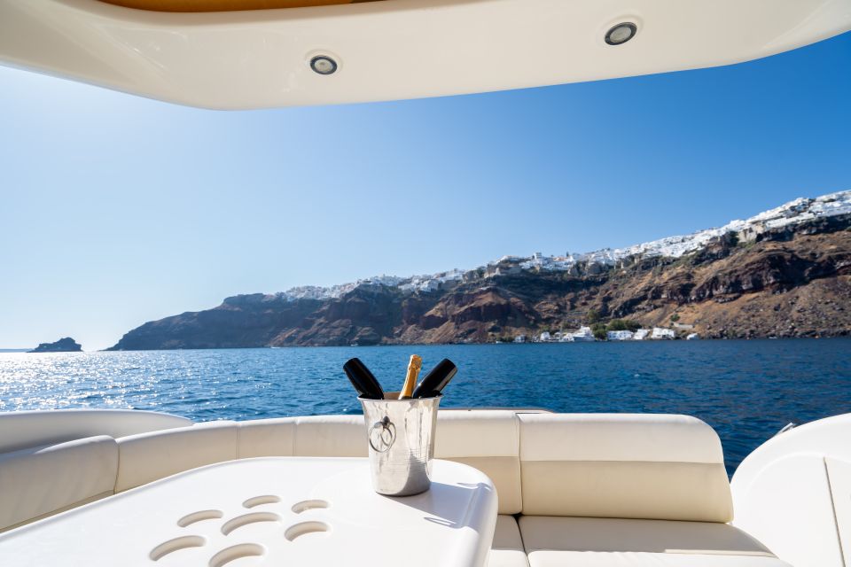 Santorini: Private Yacht Cruise With Open Bar and Meal - Departure and Stops