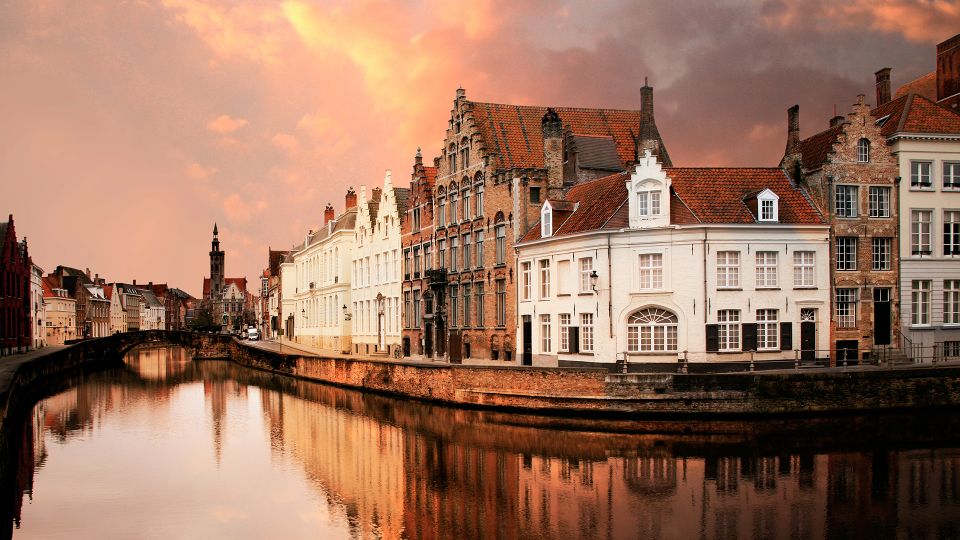 From Amsterdam: Day Trip to Bruges in Spanish - Transportation and Meeting Point