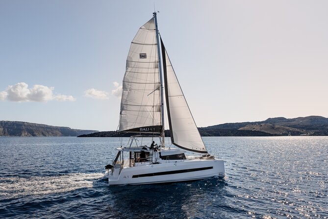 Shared Catamaran Half Day Cruise in Santorini - Onboard Amenities and Activities