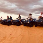 Dubai Red Dunes Quad Bike Safari, Camels, Sandsurf & Refreshment Tour Details