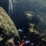 Rainforest Caves & Hidden Waterfall Adventure Navigating Captivating Cave Formations