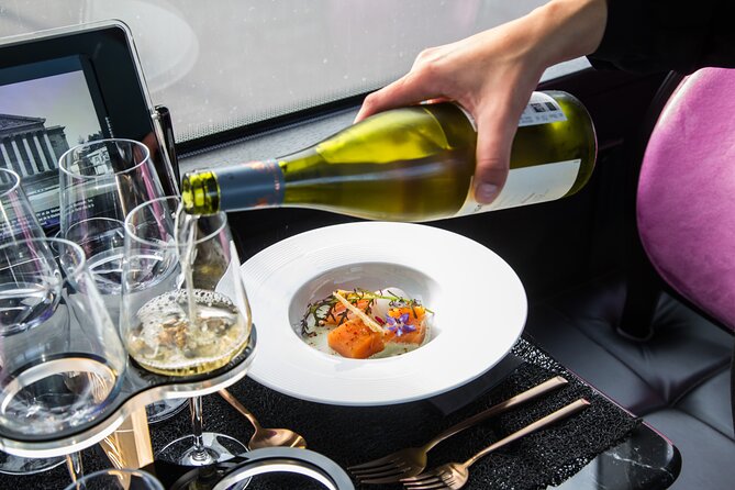 Paris Lunch Bus Toque With Glass of Champagne on Champs-Elysees - Booking and Availability