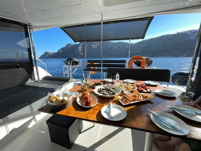 Santorini: Catamaran Cruise With Lunch, Drinks, & Oia Visit - White Beach, Red Beach, and Sunset Viewing