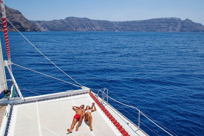 Santorini Cruise on Catamaran With BBQ & Open Bar - Inclusions and Amenities