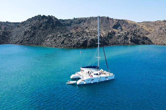 Best of Santorini Private Half-Day Catamaran Cruise With Transfer and Meal - Santorinis Scenic Catamaran Cruise