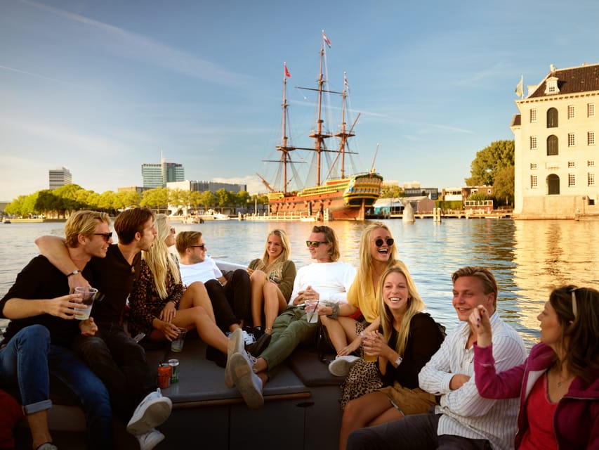 Amsterdam: 1.5-Hour Guided Canal Cruise With Drinks & Snacks - Onboard Amenities and Identification