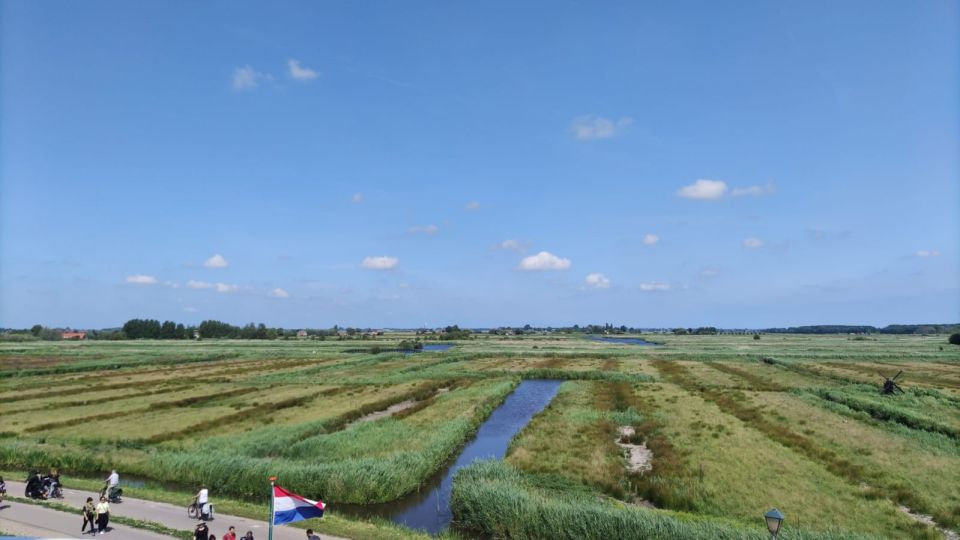 Amsterdam: Zaanse Schans Windmills Bike Tour With Guide - Languages Offered