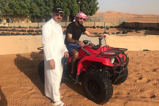 Dubai Desert Safari With BBQ Dinner Pickup From Ras Al Khaimah - Quad Bike Adventure and Panoramic Views