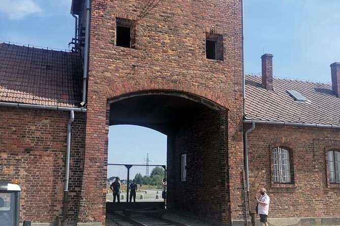 Visit to the Auschwitz Camp in Italian With Departure From Krakow - Key Points