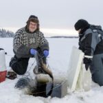 Levi: Ice Fishing By Snowmobile Snowmobile Safari Through Lapland