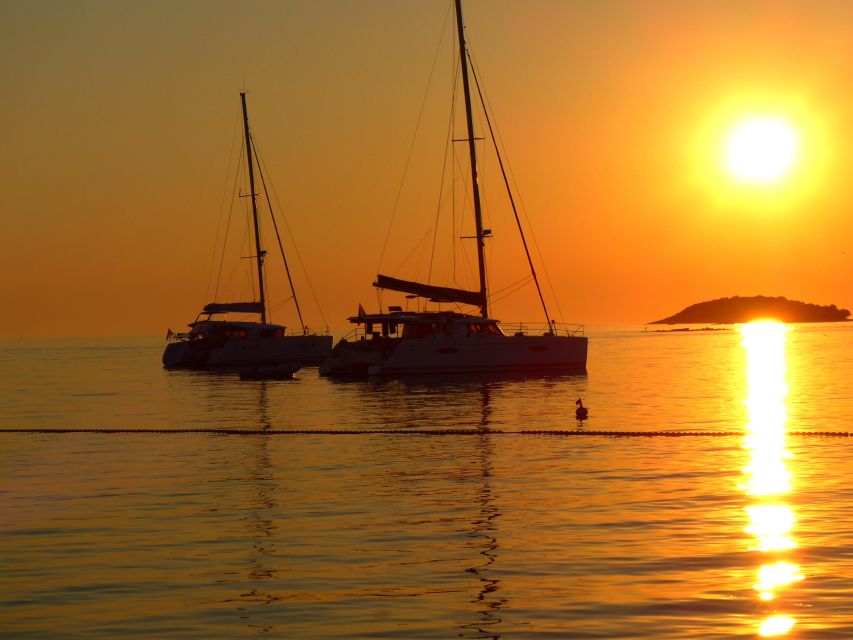 Milos: Kleftiko Bay Catamaran Cruise With Meal & Sunset View - Itinerary and Highlights