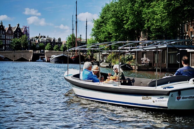 Private Family Tour Through the Small Canals of Amsterdam - Boat Identification and Features