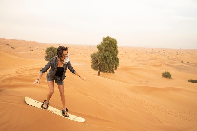 Private Red Dunes Desert Safari , BBQ Dinner and Camel Ride - Sand Boarding Adventure