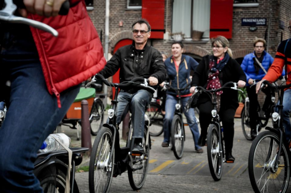 Amsterdam: Guided City Bike Tour in French - Experience and Highlights