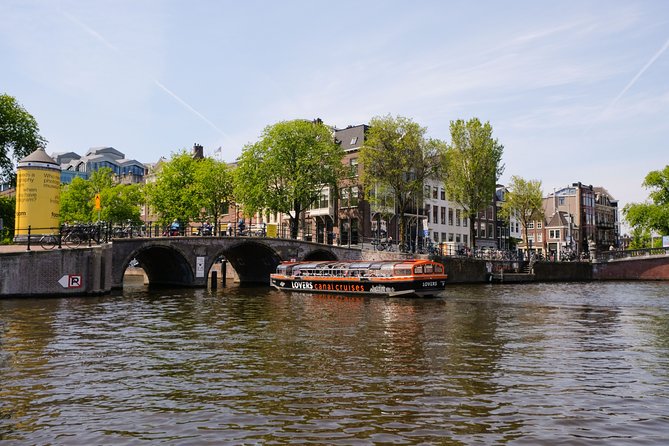 Amsterdam 1-Hour Sightseeing Canal Cruise by Semi-Open Boat - Vessel and Language Options