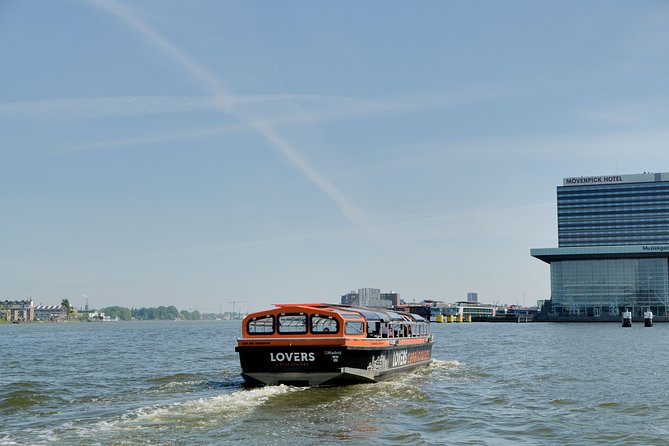 Amsterdam 1-Hour Sightseeing Canal Cruise by Semi-Open Boat - Duration and Capacity