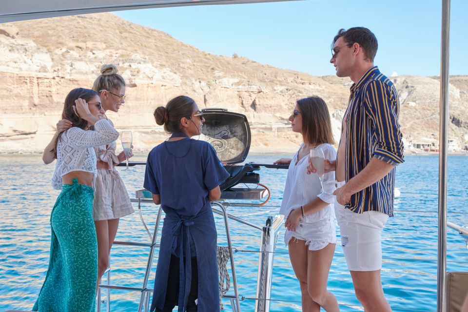 Santorini Gold Catamaran Cruise With Snorkel, BBQ & Open Bar - Onboard Amenities and Inclusions