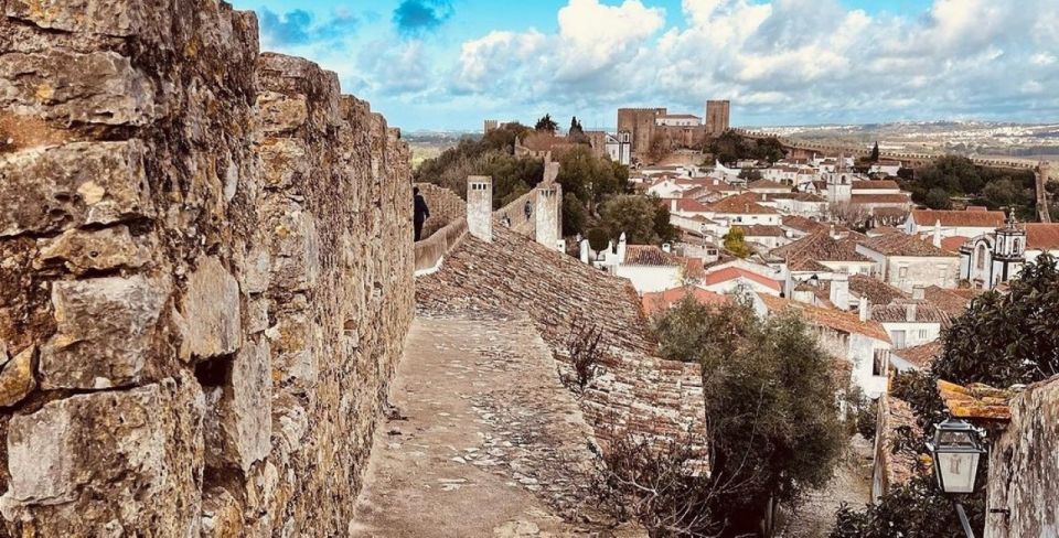 From Lisbon: Tour to Fátima, Batalha, Nazaré, and Óbidos - Wander Medieval Óbidos