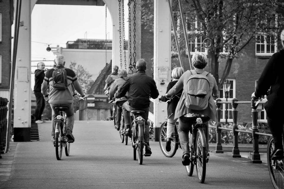 Amsterdam: Guided City Bike Tour in French - Key Points