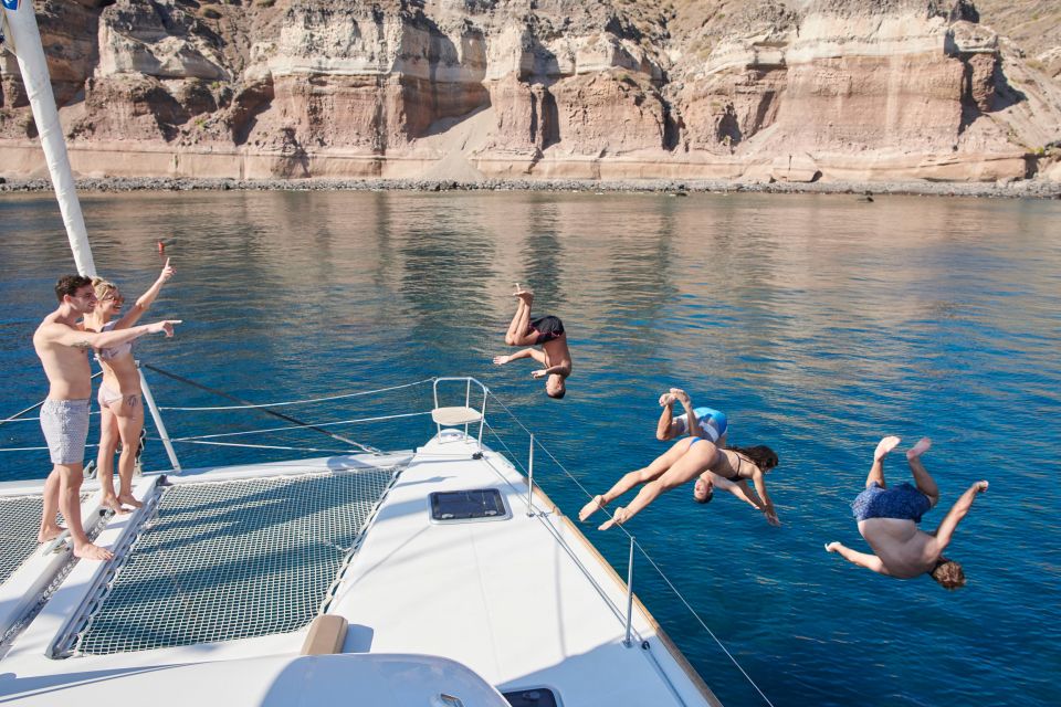 Santorini Gold Catamaran Cruise With Snorkel, BBQ & Open Bar - Key Points