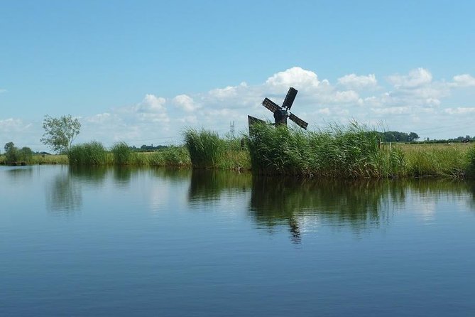 Small-Group Guided Sunset Canoe Tour in Waterland With Dinner - Key Points