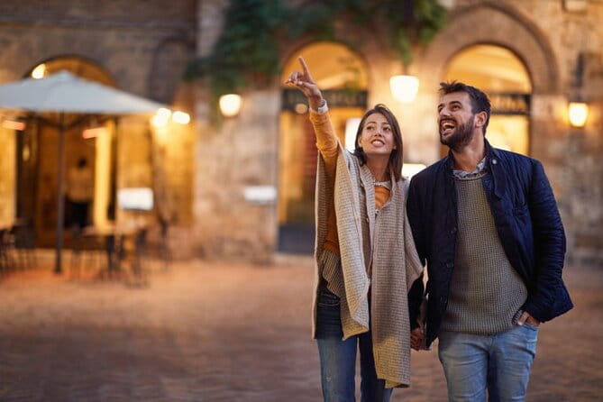 Bologna By Night Walking Tour - Strolling Through Piazza Maggiore: The Heartbeat of Bologna