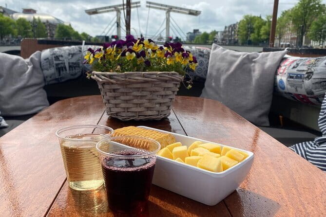 Cheese and wine cruise: Savor Amsterdams beauty and flavors - Exploring the Canal Routes and Key Stops