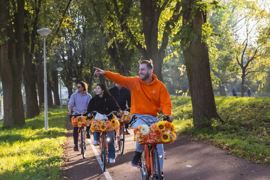 Amsterdam: Cheese, Windmill & Countryside Bike Tour - Enjoying the Iconic Windmill and Scenic Canal Rides