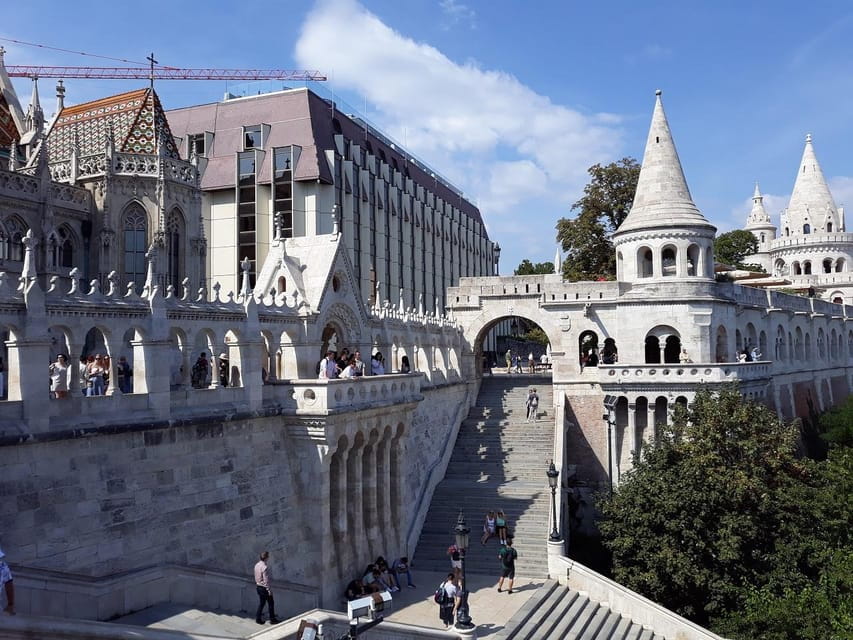 Budapest: Buda Castle Walking Tour & Folk Music Performance - Walking Through Budapest’s Buda Castle District
