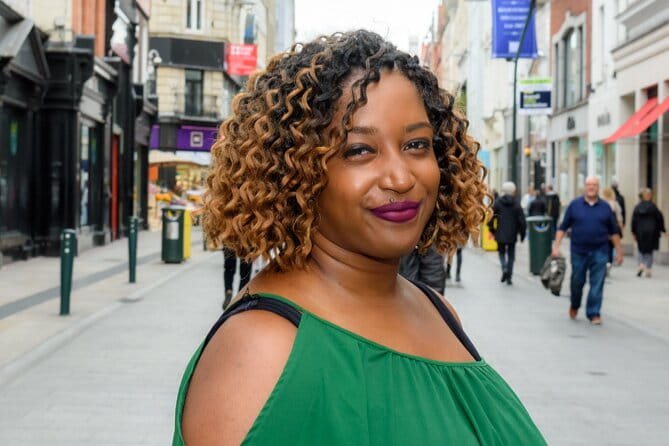 Dublin Photo Magic: Personalized & LGBTQ+ Friendly - Crossing the Iconic Hapenny Bridge