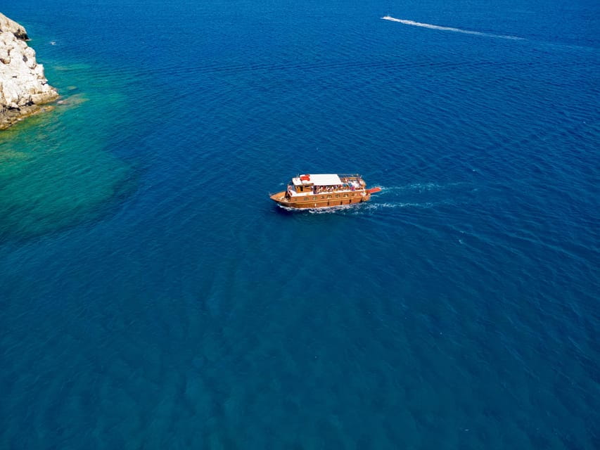 Faliraki : Transfer & Cruise to Lindos with 3 Swimming Stops - Exploring Lindos: Free Time and the Acropolis