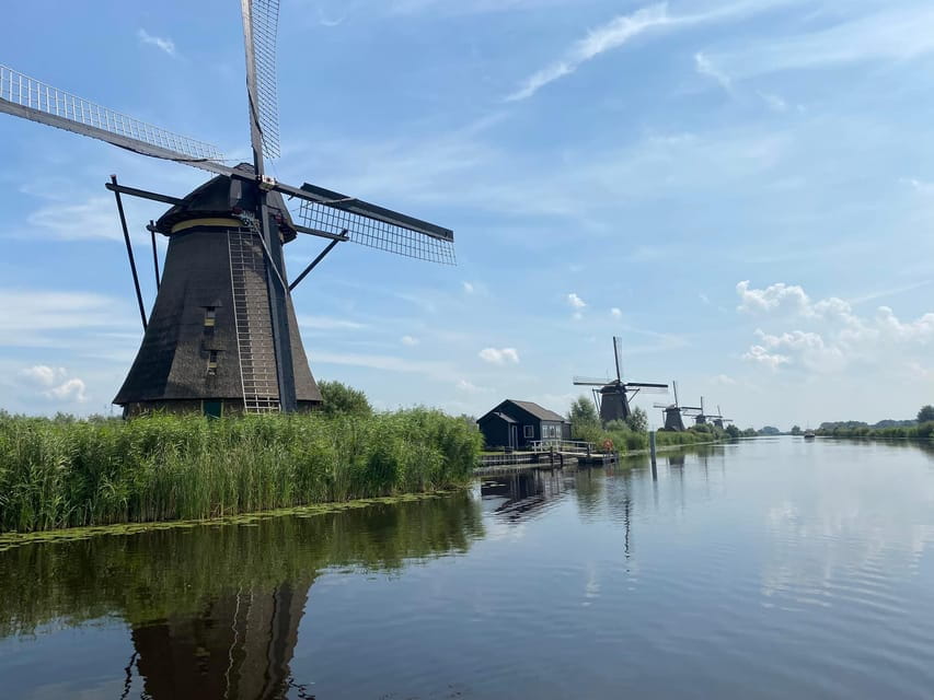 From Amsterdam: Kinderdijk, Delft & Mauritshuis Private Tour - Strolling Through Delft: Medieval Charm and Golden Age Elegance