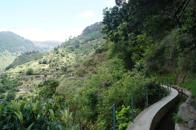 From Funchal: Levada Nova Hiking Tour with stopover at beach - The Scenic Trail: Waterfalls, Bridges, and Flowers