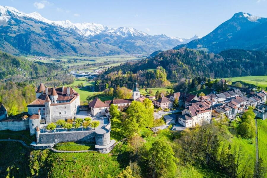 From Geneva: Gruyeres Castle, Cheese, Chocolate & Montreux - Entering the Medieval Charm of Gruyères