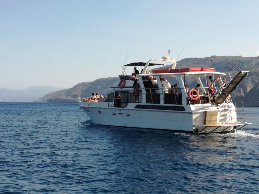 FULL DAY GROUP TOUR KOUTSOMITI KOUNOUPA & RED ROCK WITH MEAL - The Itinerary in Detail: From Red Rock to Hidden Beaches