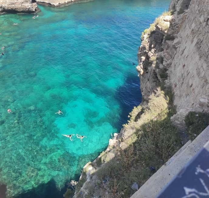 Polignano a Mare & Alberobello: Highliths Tour in Tesla - Polignano a Mare: Cliffside Charm & Emerald Waters